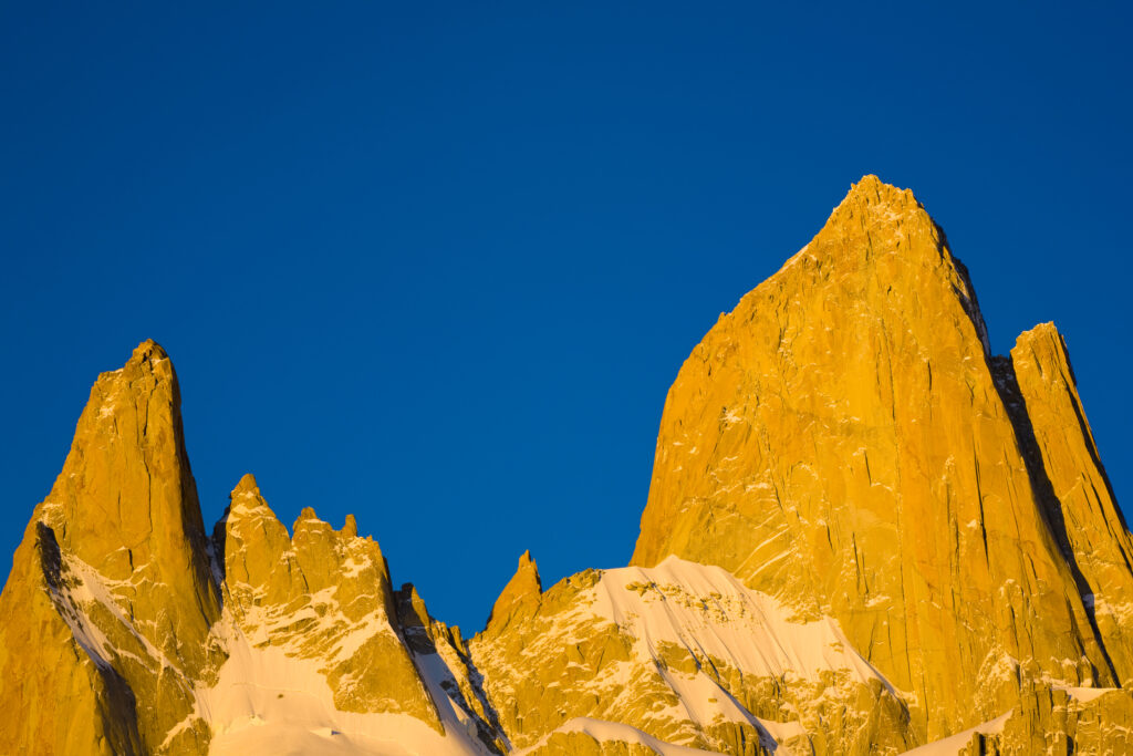 Argentina, Patagonia, Los Glaciares National Park. Dawn light hits the peaks of Poincenot Fitz Roy Mermoz and Guillaumet mountains