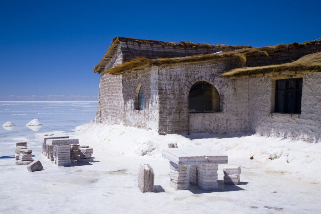 Bolivia, Southern Altiplano, Salar de Uyuni. Building and seating constructed of salt, located on the Salar de Uyuni salt flat.