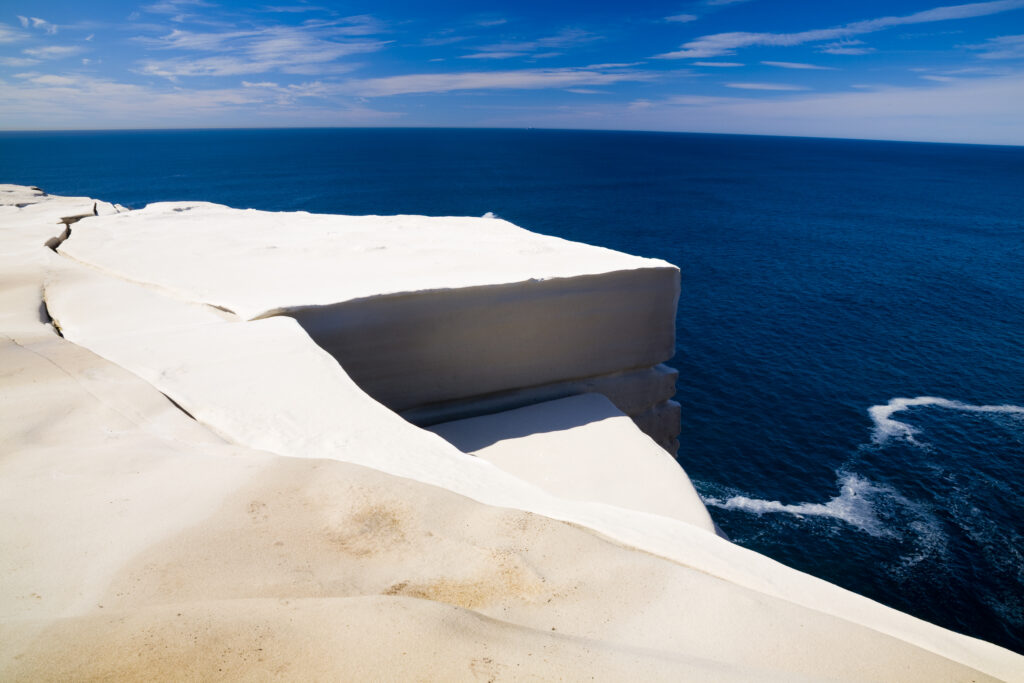 Australia, New South Wales, Royal National Park. Sandstone cliifs overlooking the Pacific Ocean viewed from the Royal National Park Coastal Track.