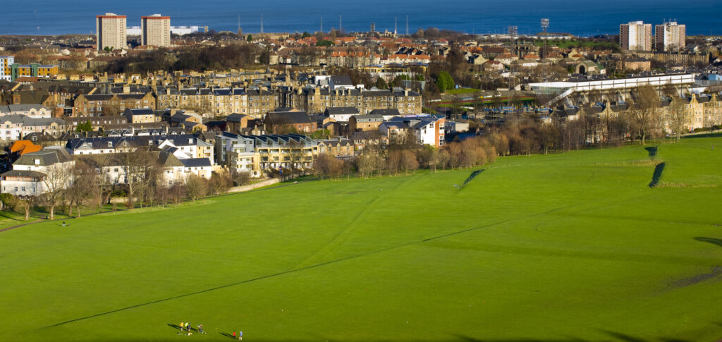 Scotland, Edinburgh, Holyrood Park. People partaking in sports activities at the Holyrood Park.