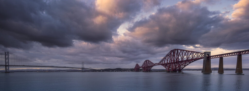 Scotland, Edinburgh, Forth Bridge. Forth Railway Bridge & Forth Road Bridge connecting Scotland's capital city, Edinburgh, with Fife, leaving the Lothians at Dalmeny and arriving in Fife at North Queensferry.