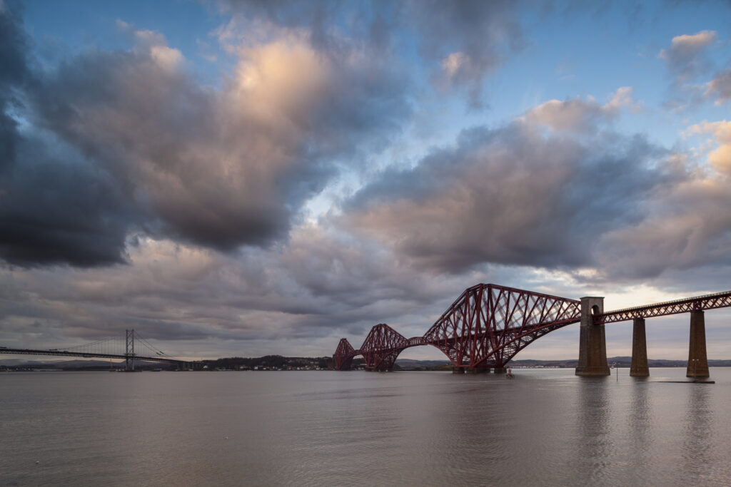 Scotland, Edinburgh, Forth Bridge. Forth Railway Bridge & Forth Road Bridge connecting Scotland's capital city, Edinburgh, with Fife, leaving the Lothians at Dalmeny and arriving in Fife at North Queensferry.
