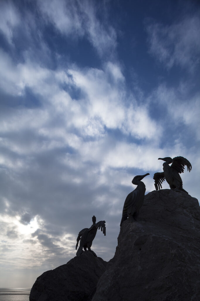 England, Lancashire, Morecambe. Cormorant statues on Morecambe's sea front promenade as part of the Tern regeneration project.