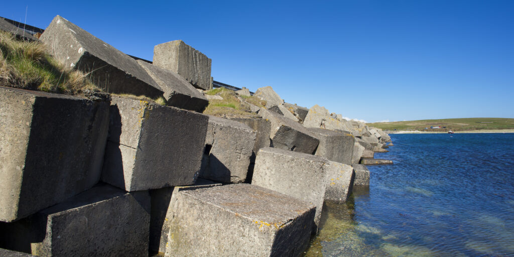 Scotland, Orkney Islands, Churchill Barrier. Churchill Barrier No. 3, linking Glimps Holm and Burray, built by prisoners of war in WW2 to protect the Royal Navy anchorage in Scapa Flow from German U-boats.