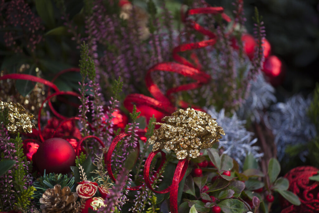 England, Greater Manchester, Manchester. Christmas decorations on sale at a stall on the Town Hall Christmas Market.