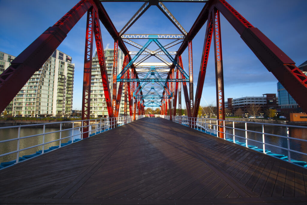 England, Greater Manchester, Salford Quays. NV apartments and Detroit Bridge located along the Manchester Ship Canal in Salford.