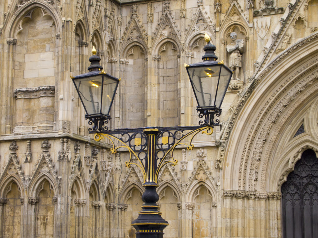 England, North Yorkshire, York City. Ornate lamp outside of the West Front entrance of York Minster.