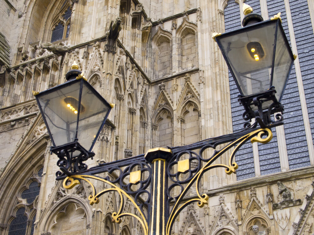 England, North Yorkshire, York City. Ornate lamp outside of the West Front entrance of York Minster.