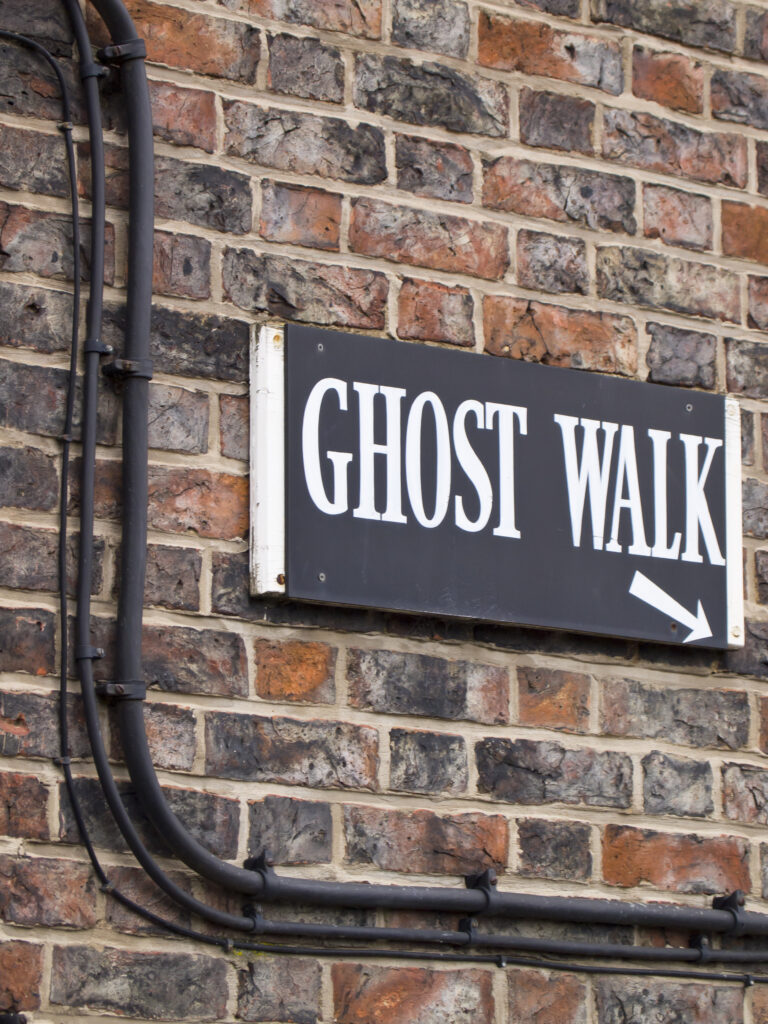 England, North Yorkshire, York City. Ghost Walk starting point sign on a wall near the River Ouse.