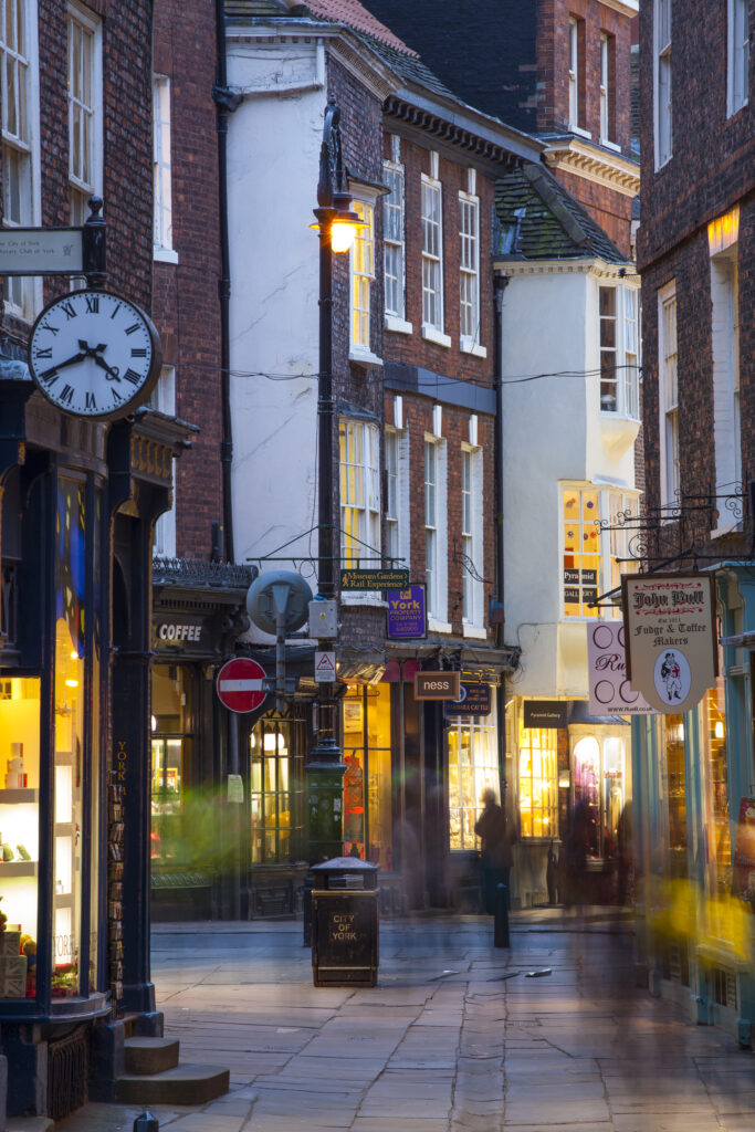 England, North Yorkshire, York City. Busy shopping street near the Cathedral, Stonegate and the Shambles.