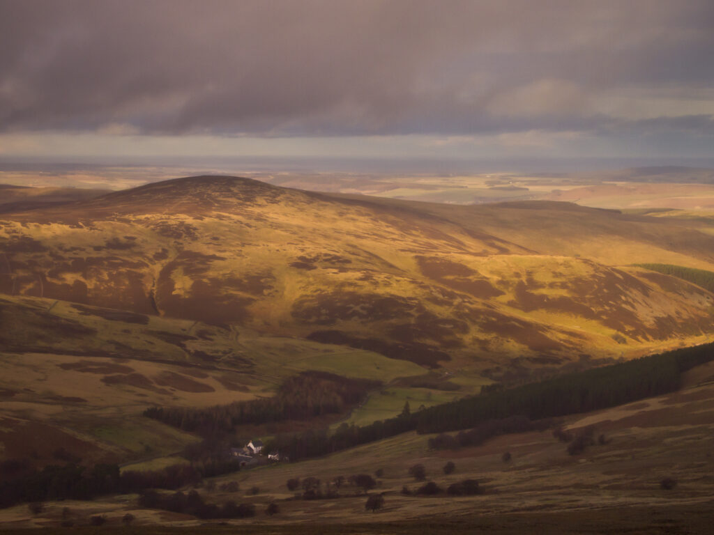England, Northumberland, Northumberland National Park. Looking down towards the Harthope Valley, during a rain storm, from the upper slopes of the Cheviot Hills.