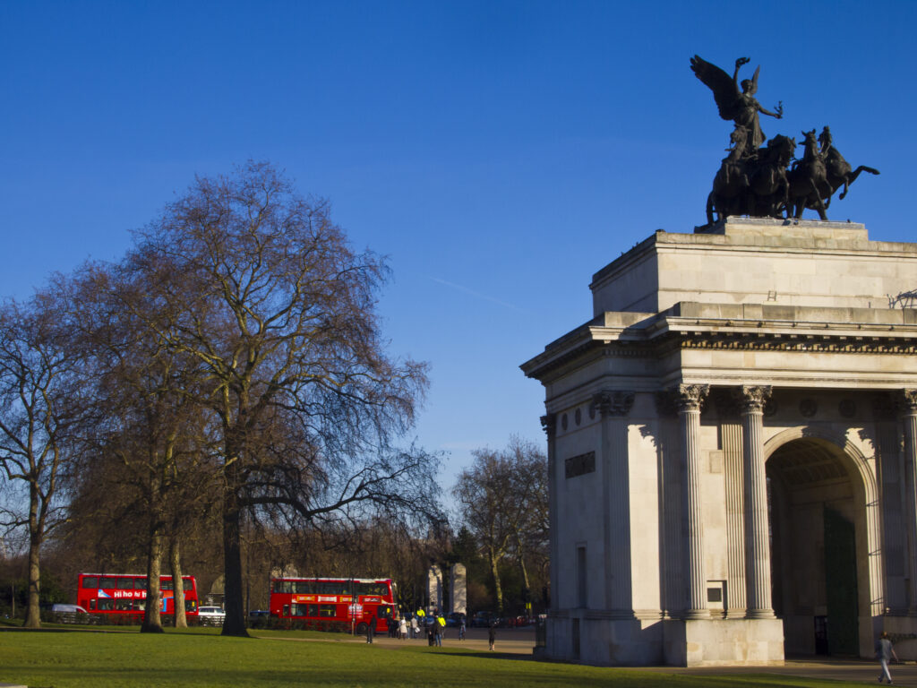 England, London, Hyde Park. Hyde Park Corner with the Quadriga sculpture on top of the Wellington / Constitution Arch in the distance.