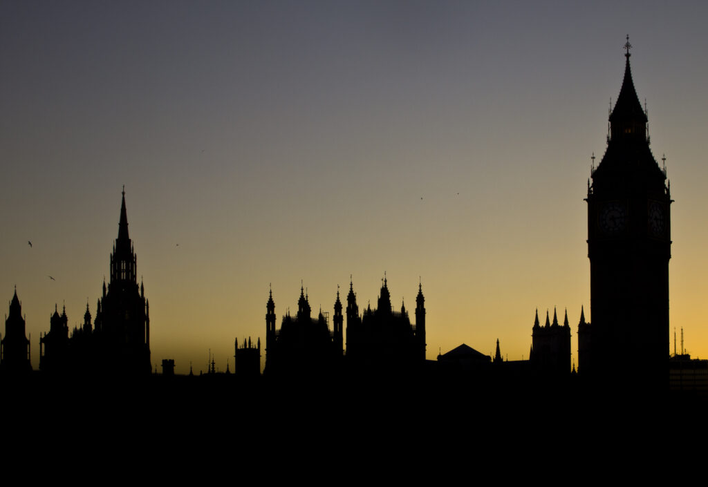 England, Greater London, City of Westminster. Sunset behind the iconic Big Ben also known as the Clock Tower, and the Houses of Parliament building (also known as the Palace of Westminster), located in the City of Westminster, London.