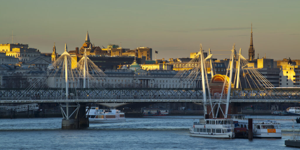 England, Greater London, Golden Jubilee Bridge. View looking towards the Golden Jubilee Bridge from the Southbank of the River Thames.