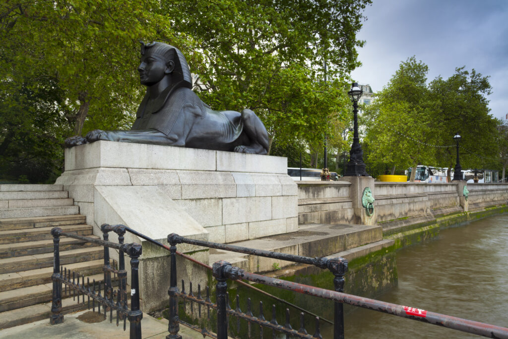 England, Greater London, Embankment. Sphinx located on embankment on the river Thames.