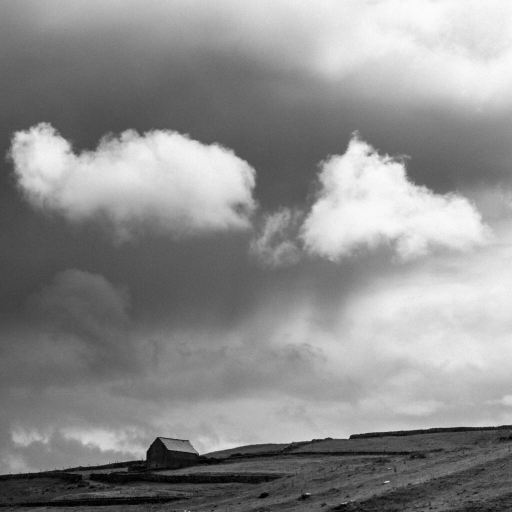 England, North Yorkshire, Yorkshire Dales National Park. A stone farm building in the Yorkshire Dales National Park near Malham Cove and Gordale Scar.