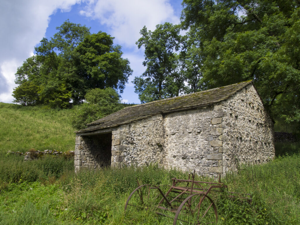 England, North Yorkshire, Yorkshire Dales National Park. A stone farm building in the Yorkshire Dales National Park near Malham Cove and Gordale Scar.