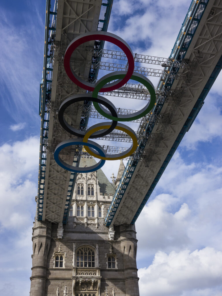 England, Greater London, Pool of London. 2012 Olympic Rings on the iconic Tower Bridge which spans the River Thames near the Tower of London.