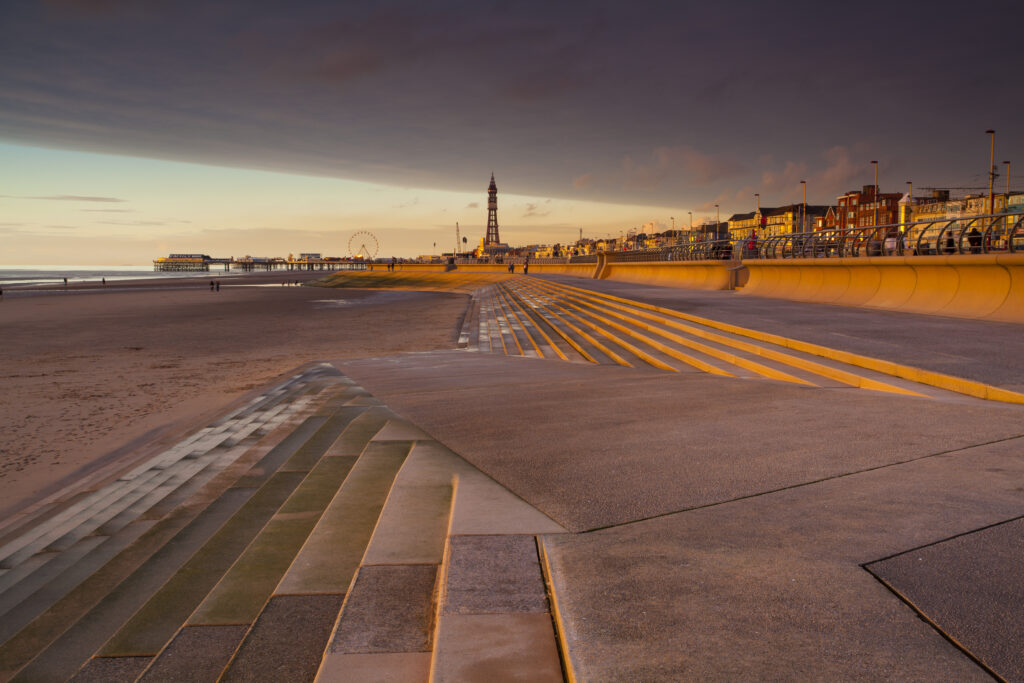 England, Lancashire, Blackpool. Blackpool Seafront Steps and Sea Defenses looking towards the Blackpool Tower.