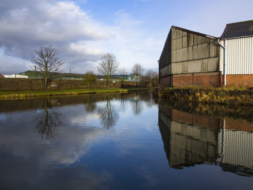 England, West Midlands, Stourbridge Canal. Industrial unit located on the Stourbridge Canal near Brierley Hill in the Black Country.