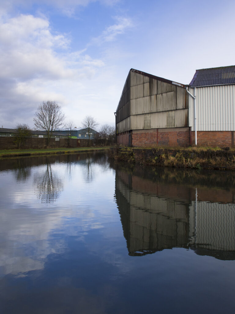 England, West Midlands, Stourbridge Canal. Industrial unit located on the Stourbridge Canal near Brierley Hill in the Black Country.