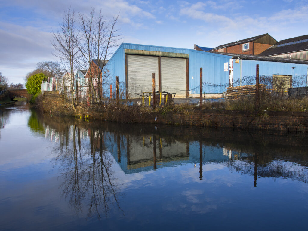 England, West Midlands, Stourbridge Canal. Industrial unit located on the Stourbridge Canal near Brierley Hill in the Black Country.