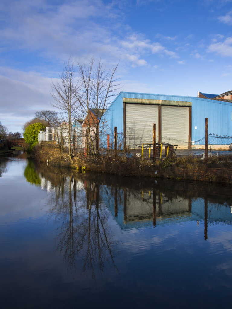England, West Midlands, Stourbridge Canal. Industrial unit located on the Stourbridge Canal near Brierley Hill in the Black Country.