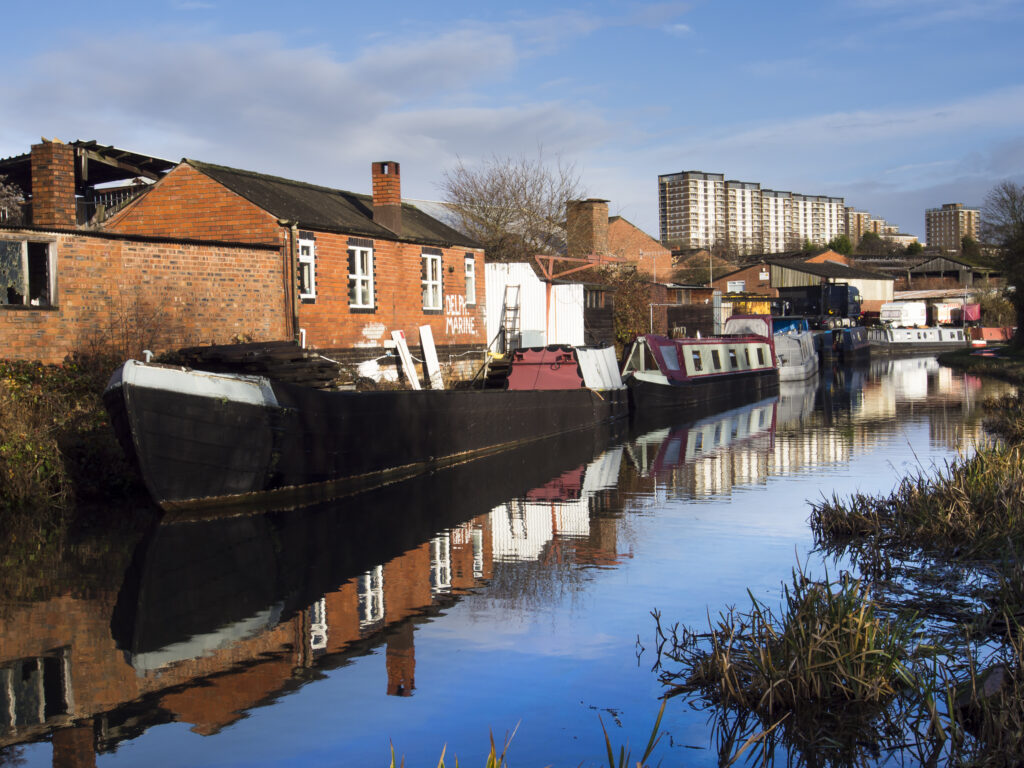 England, West Midlands, Stourbridge Canal. Narrowboats moored at Delph Marine, known locally as the boat yard, located near the Delph Nine Locks at Brierley Hill in the Black Country.