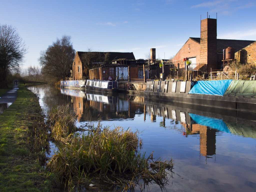 England, West Midlands, Stourbridge Canal. Narrowboats moored at Delph Marine, known locally as the boat yard, located near the Delph Nine Locks at Brierley Hill in the Black Country.