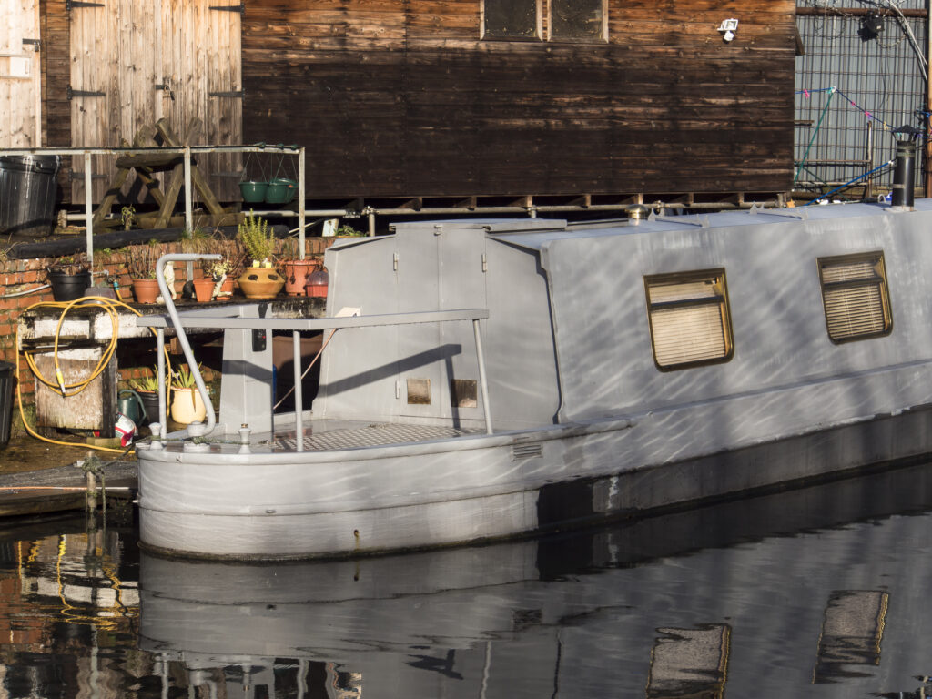 England, West Midlands, Stourbridge Canal. Narrowboats moored at Delph Marine, known locally as the boat yard, located near the Delph Nine Locks at Brierley Hill in the Black Country.