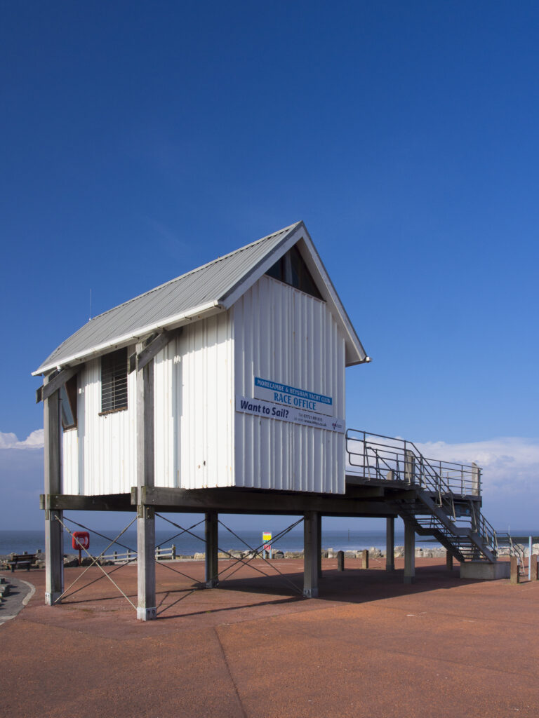 England, Lancashire, Morecambe. Morecambe & Heysham Yacht Club building on the sea front at Morecambe / Morecambe Bay.