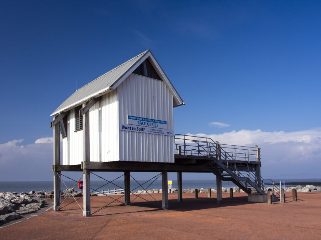 England, Lancashire, Morecambe. Morecambe & Heysham Yacht Club building on the sea front at Morecambe / Morecambe Bay.