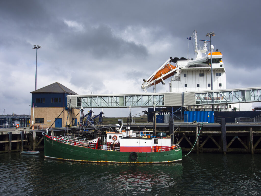 Scotland, Orkney Islands, Mainland Orkney. A variety of sea boats moored in Stromness Harbour on mainland Orkney.