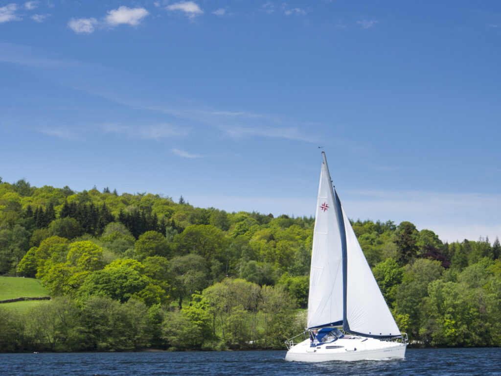 England, Cumbria, Lake District National Park. Sailing Boat on Lake Windermere.