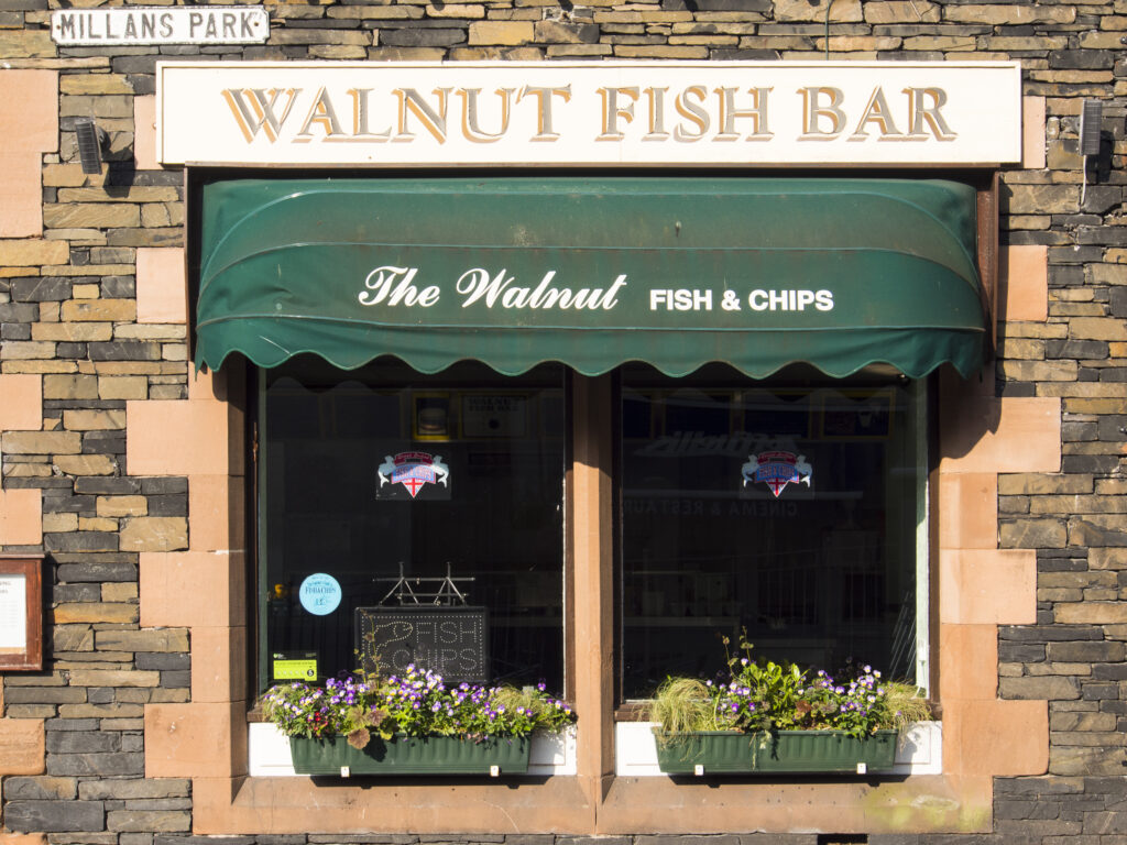 England, Cumbria, Lake District National Park. Traditional fish and chip take away shop in Ambleside.