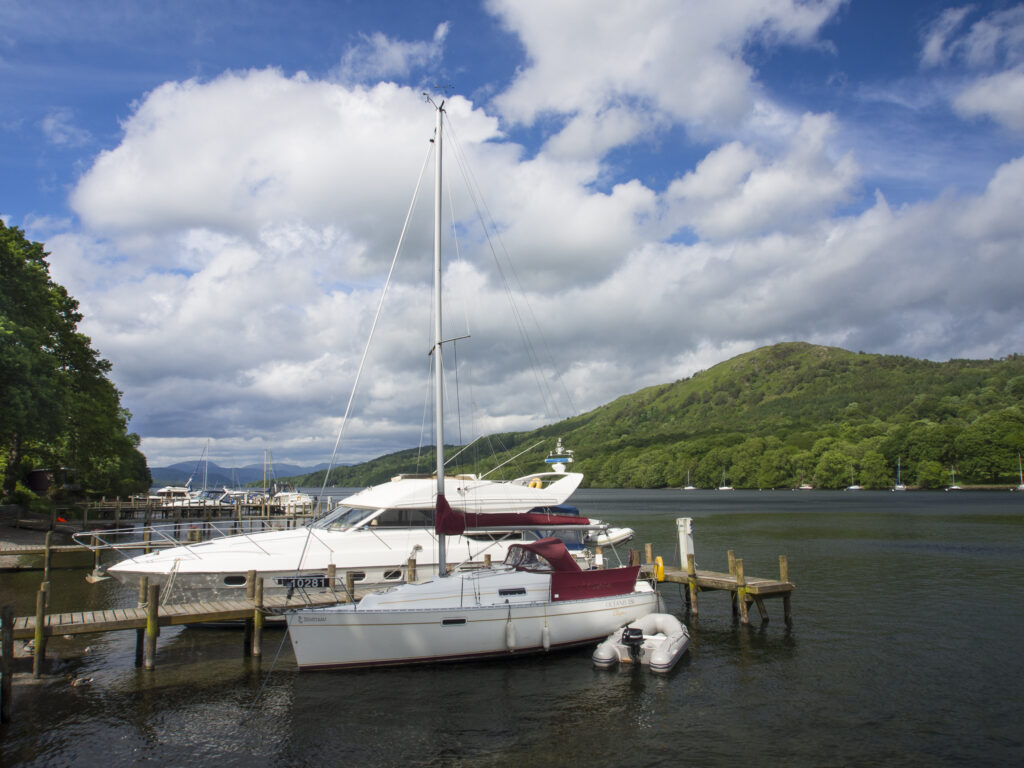 England, Cumbria, Lake District National Park. Boats moored on the Lakeside Hotel private moorings.
