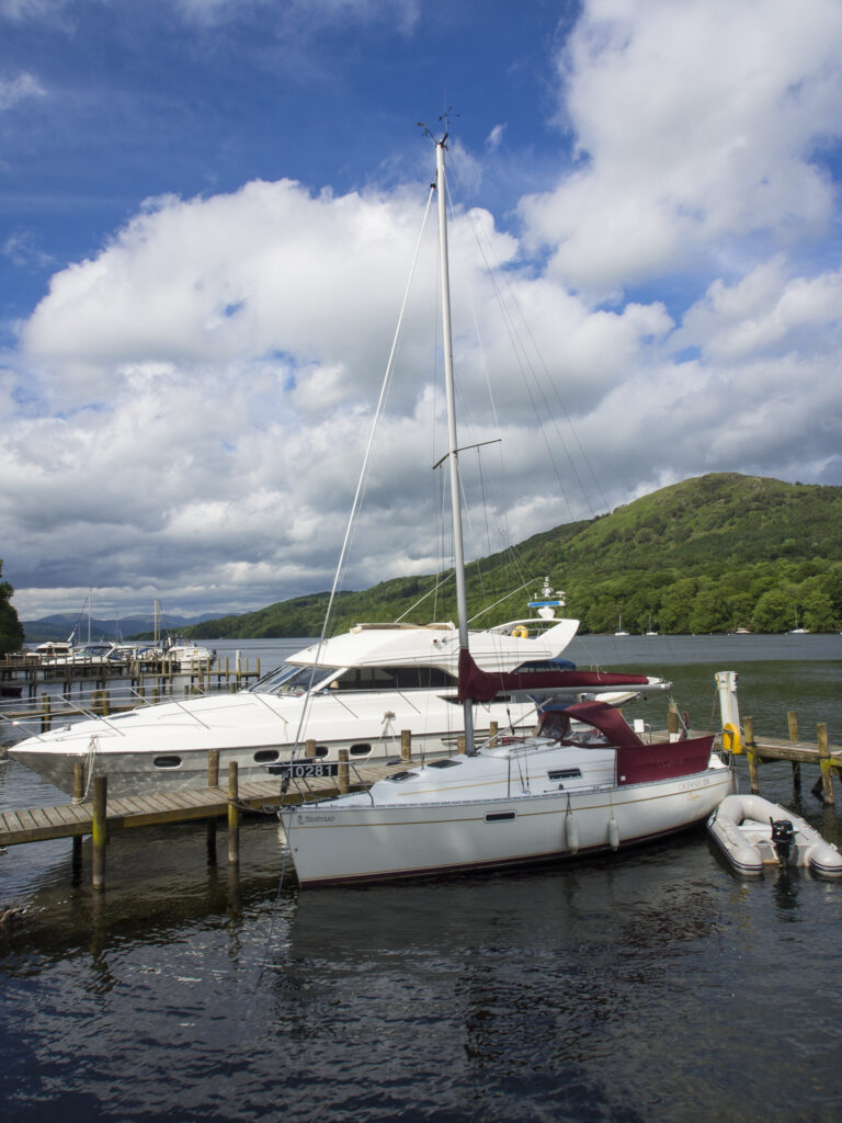England, Cumbria, Lake District National Park. Boats moored on the Lakeside Hotel private moorings.