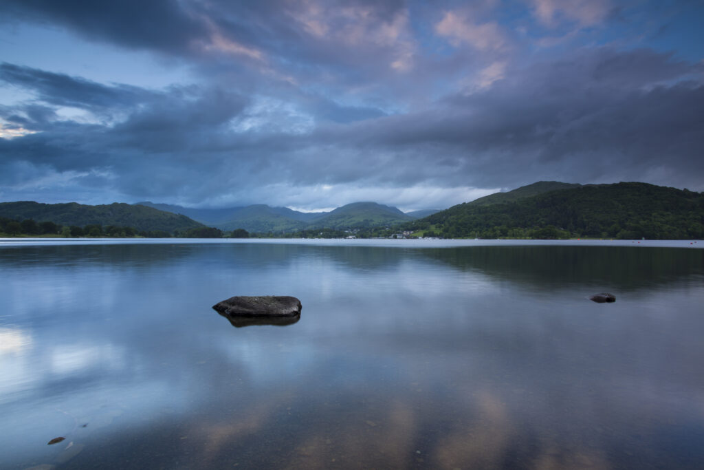 England, Cumbria, Lake District National Park. Dusk on Lake Windermere, viewed from Low Wray looking towards Ambleside.