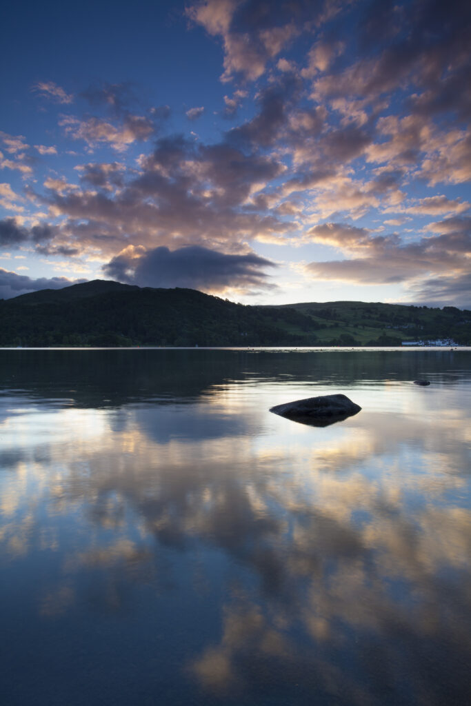 England, Cumbria, Lake District National Park. Sunrise on Lake Windermere, viewed from Low Wray looking towards Low Wood Bay.