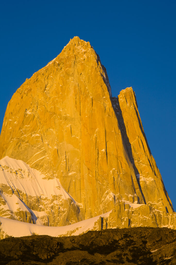 Argentina, Patagonia, Los Glaciares National Park. Dawn light hits the peaks of Poincenot Fitz Roy Mermoz and Guillaumet mountains