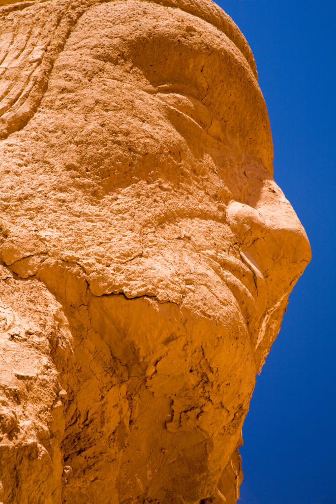 Chile, Atacama Desert, Plaza Quitor. Carved face in the stone wall of the Atacama Desert near the Plaza Quitor.