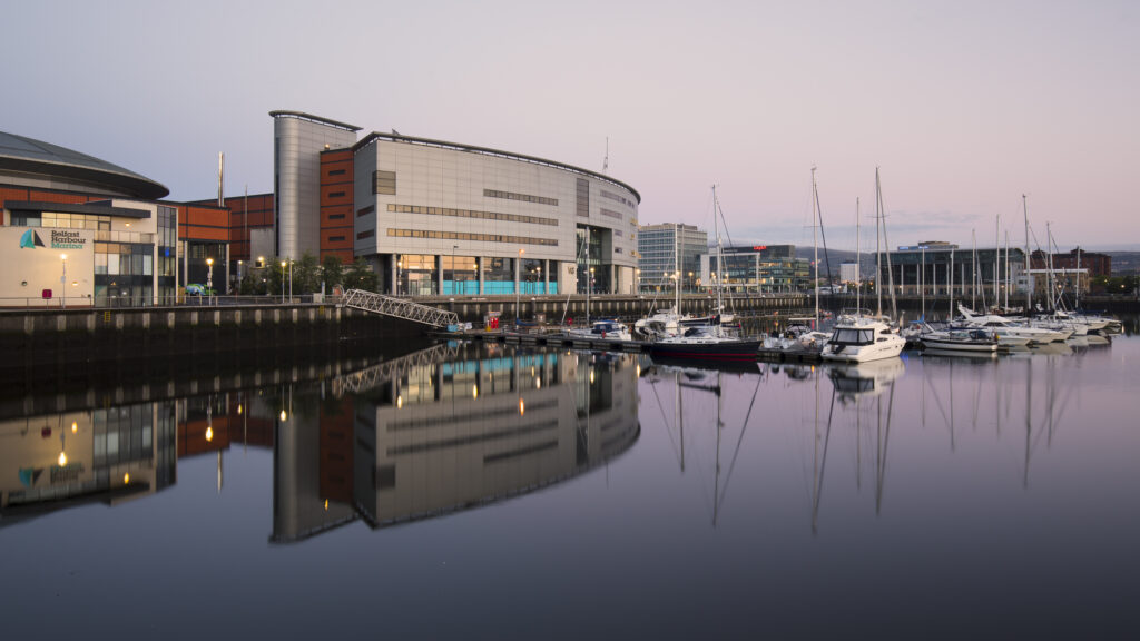 Northern Ireland, Belfast, Belfast Harbour Marina. Boats reflected on the still waters of the Belfast Harbour Marina at dawn.