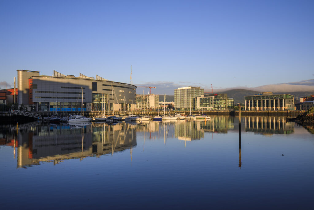 Northern Ireland, Belfast, Belfast Harbour Marina. Boats reflected on the still waters of the Belfast Harbour Marina shortly after sunrise