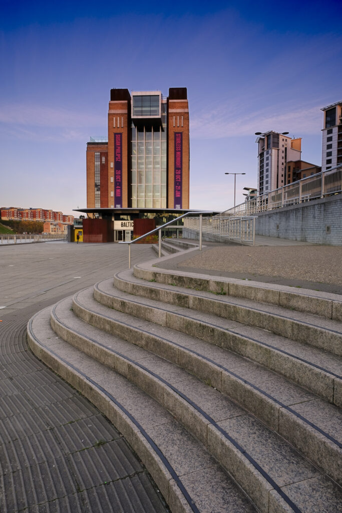England, Tyne and Wear, Newcastle Upon Tyne. The Baltic Building located alongside the River Tyne and Newcastle / Gatehead Quayside.