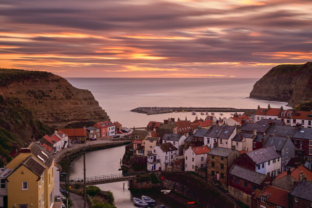England, North Yorkshire, North York Moors National Park. Early morning light at Staithes, a coastal village in the North York Moors National Park.