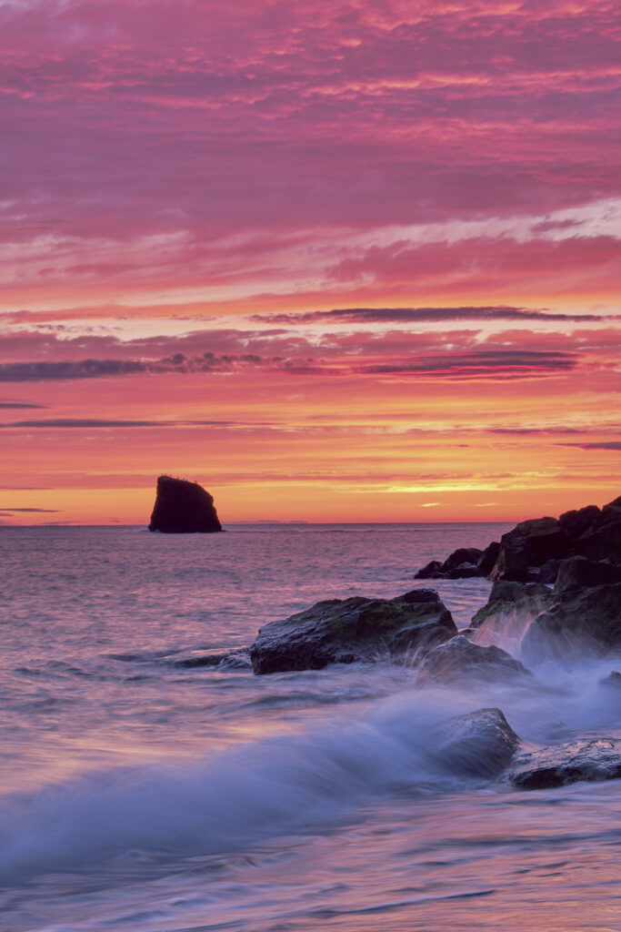 England, North Yorkshire, North York Moors National Park. Early morning light at Saltwick Bay and Nab near Whitby.