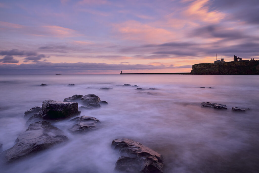 England, Tyne and Wear, King Edward's Bay. View from Sharpness Point looking across King Edward's Bay towards Tynemouth Priory.