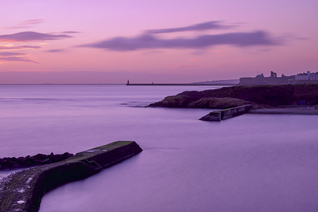 England, Tyne and Wear, Cullercoats. Sunrise over Cullercoats Bay.
