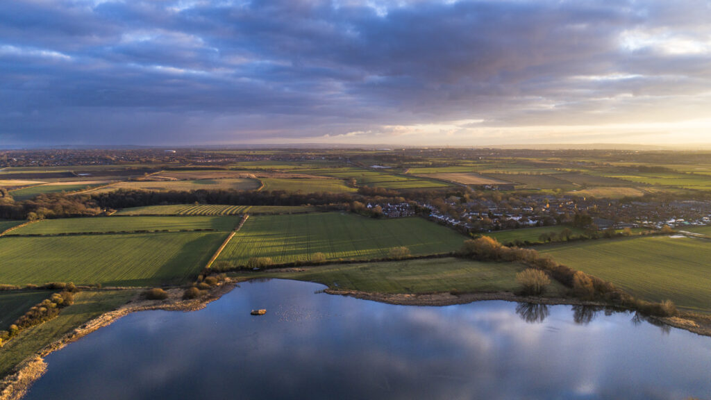 England, Northumberland, Holywell. Aerial view of Holywell Pond, a Northumberland Wildife Trust reserve near Whitley Bay.