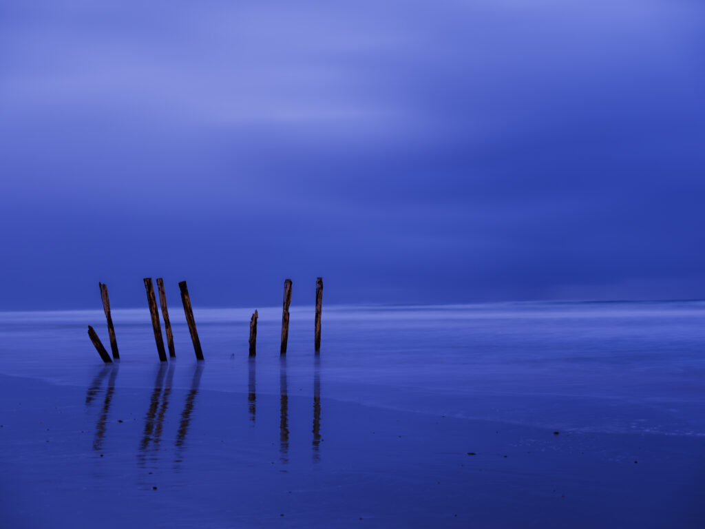 New Zealand, Dunedin, St Clair Beach. The blue tones of pre-dawn at St Clair, a popular seaside resort in Dunedin, Otago.